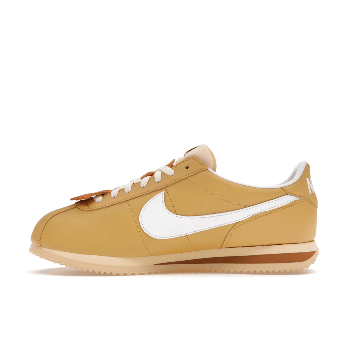 gold nike cortez